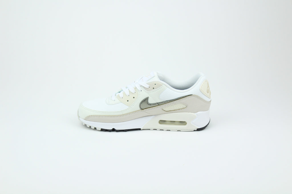 Nike Air Max 90 (Women's) sneakers in 'White & Flat Pewter' colorway, stylish and comfortable women's athletic shoes with white and pewter accents, perfect for casual and sporty wear.