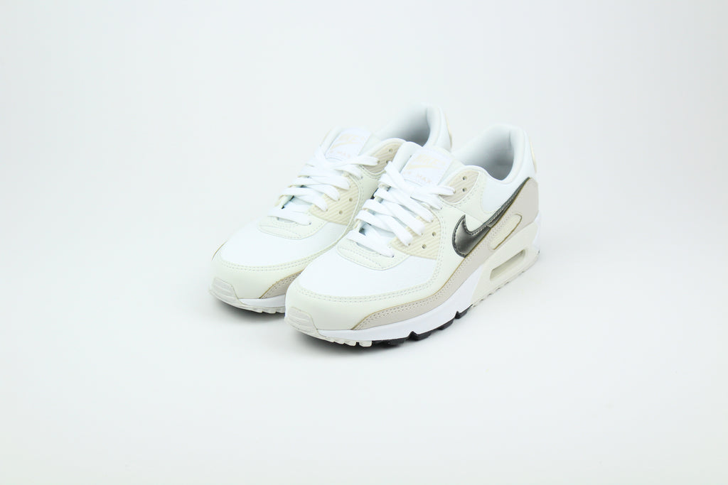 Nike Air Max 90 (Women's) sneakers in 'White & Flat Pewter' colorway, stylish and comfortable women's athletic shoes with white and pewter accents, perfect for casual and sporty wear.
