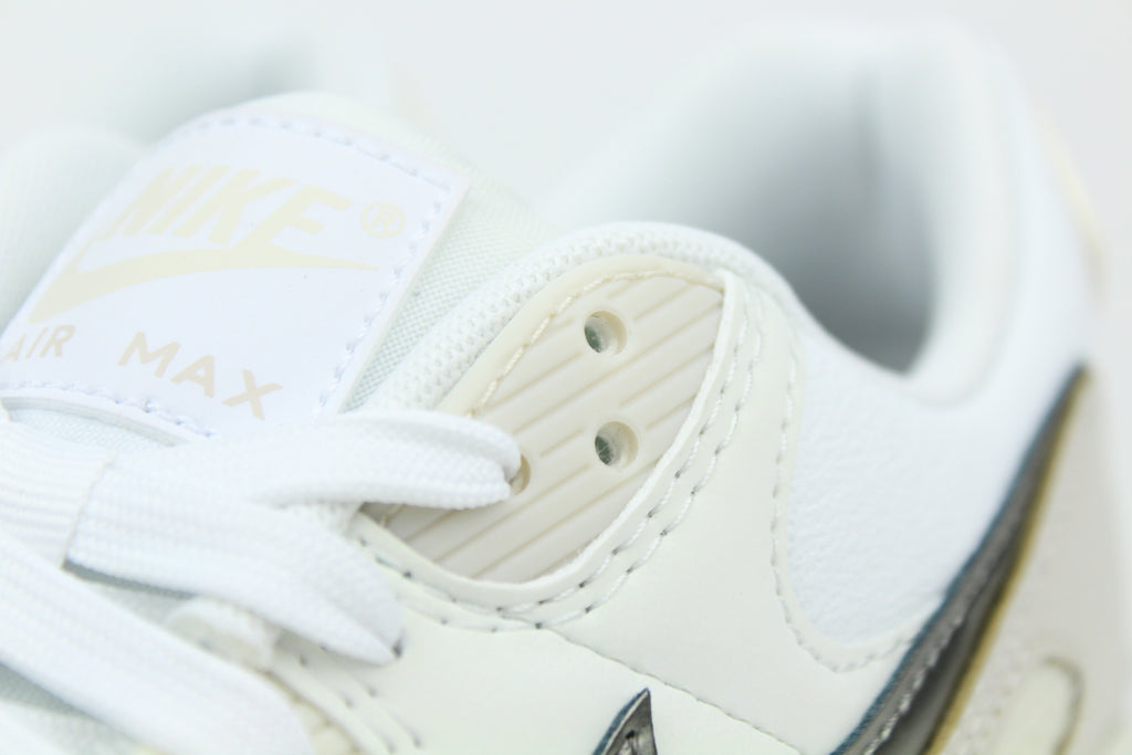 Nike Air Max 90 (Women's) sneakers in 'White & Flat Pewter' colorway, stylish and comfortable women's athletic shoes with white and pewter accents, perfect for casual and sporty wear.