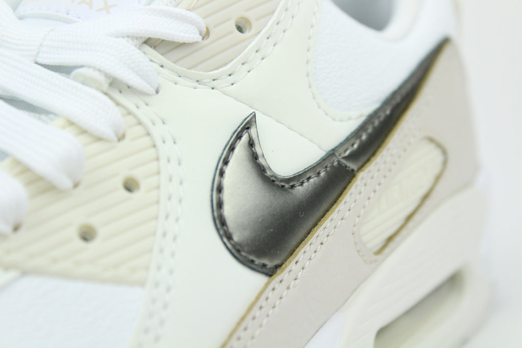 Nike Air Max 90 (Women's) sneakers in 'White & Flat Pewter' colorway, stylish and comfortable women's athletic shoes with white and pewter accents, perfect for casual and sporty wear.