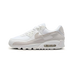 Nike Air Max 90 White Photon Dust Summit White sneaker with white mesh and leather upper soft grey tones and classic Air Max cushioning available at The Attic