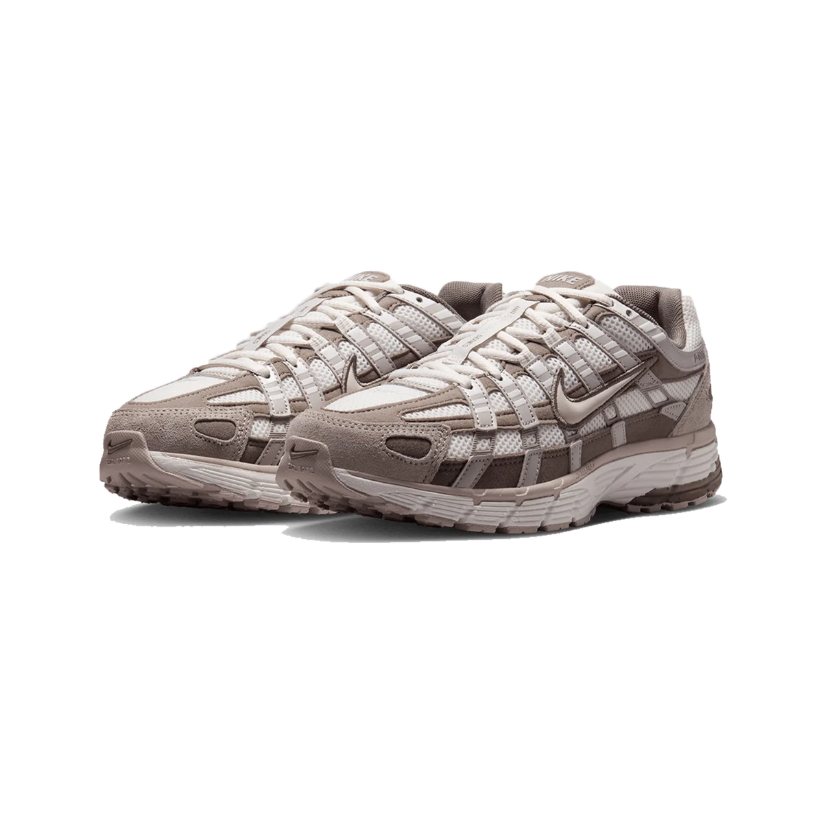 Pair of Nike P-6000 sneakers in taupe and white with layered mesh and suede paneling, chunky treaded sole, shown at a front angled view.
