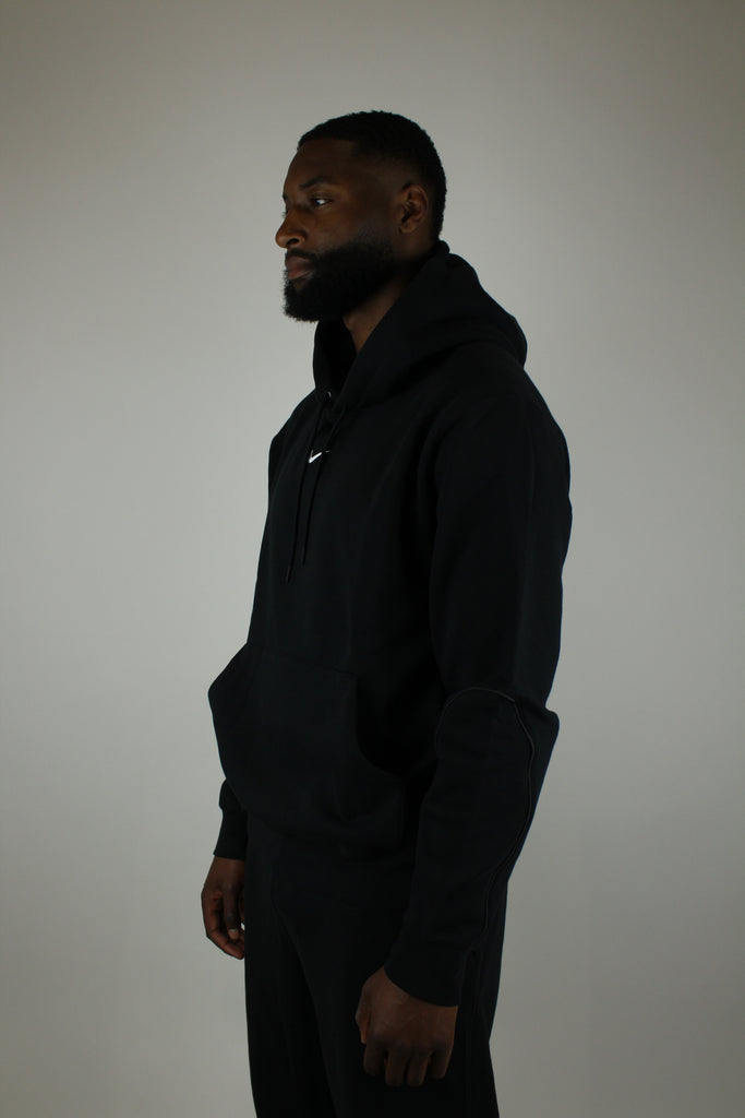 Nike x NOCTA Fleece CS Hoodie ‘Black’ – stylish black fleece hoodie featuring collaboration branding, soft and warm fabric, and a relaxed fit, perfect for streetwear and casual wear.
