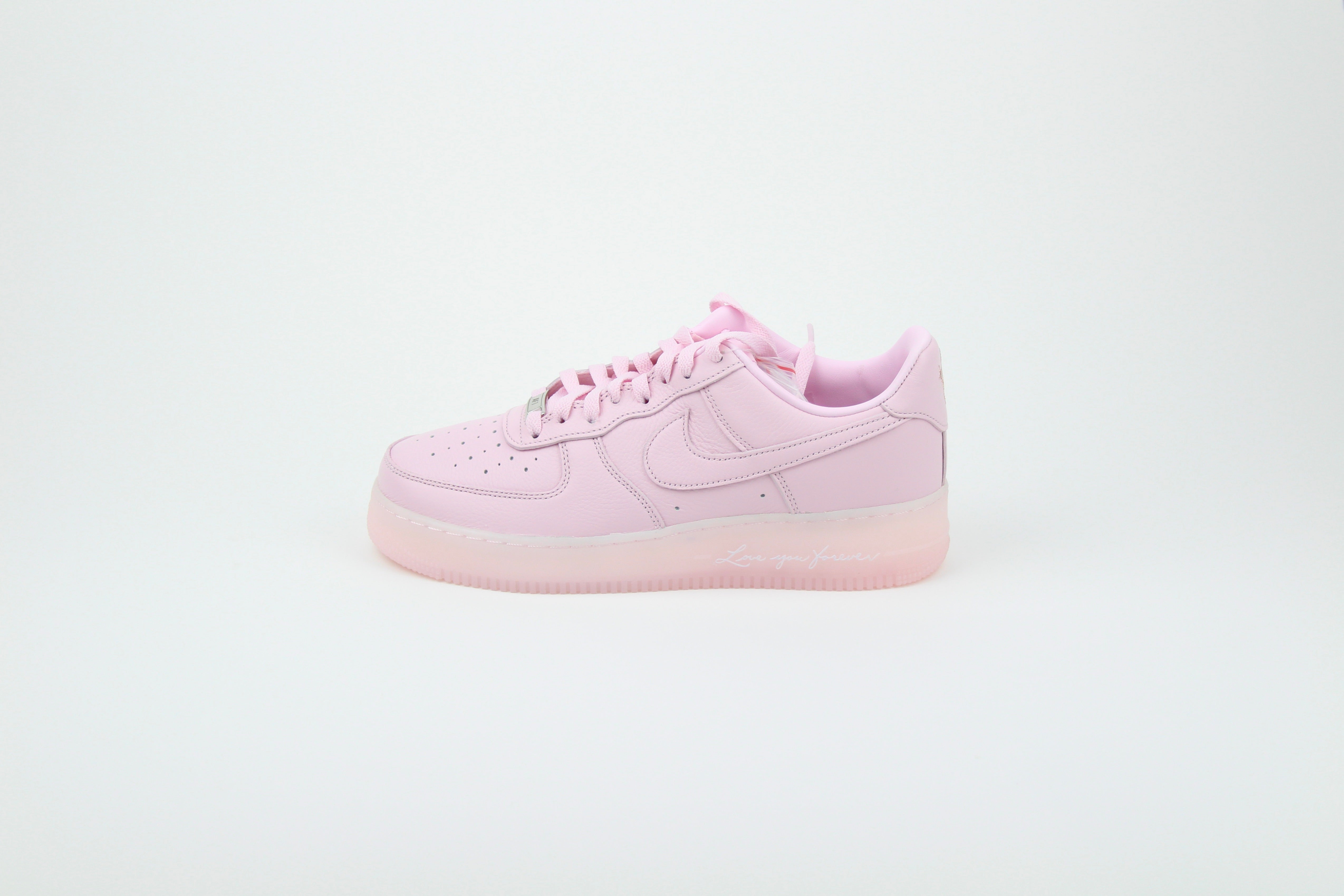 NOCTA x Nike Air Force 1 Low 'Pink Foam' from Certified Lover Boy Pack in soft pink leather. Classic cushioning meets fresh, streetwear style.
