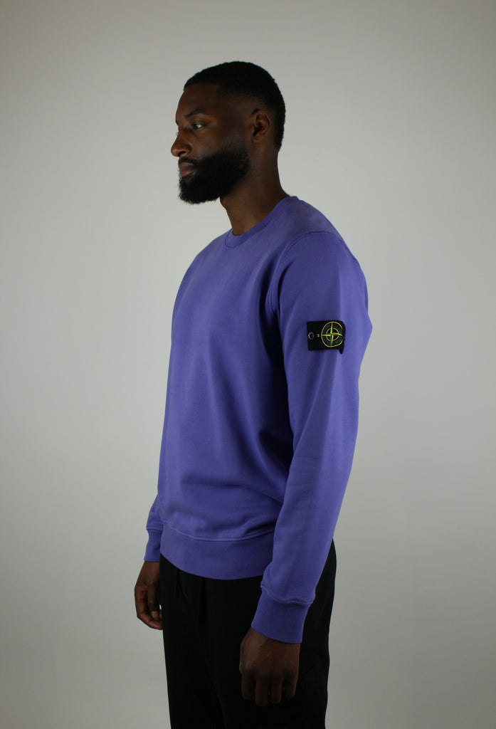 Shop the Stone Island Felpa Crewneck 'Purple' – a premium cotton crewneck with the iconic compass patch, combining comfort, quality, and standout streetwear style.
