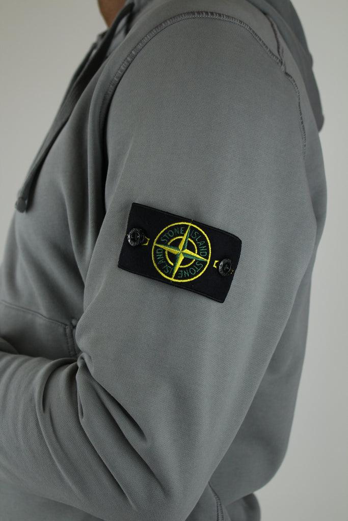 Shop the Stone Island Felpa Hoodie 'Grey' – a premium cotton hoodie with a relaxed fit, iconic compass patch, and versatile grey color for classic streetwear style.