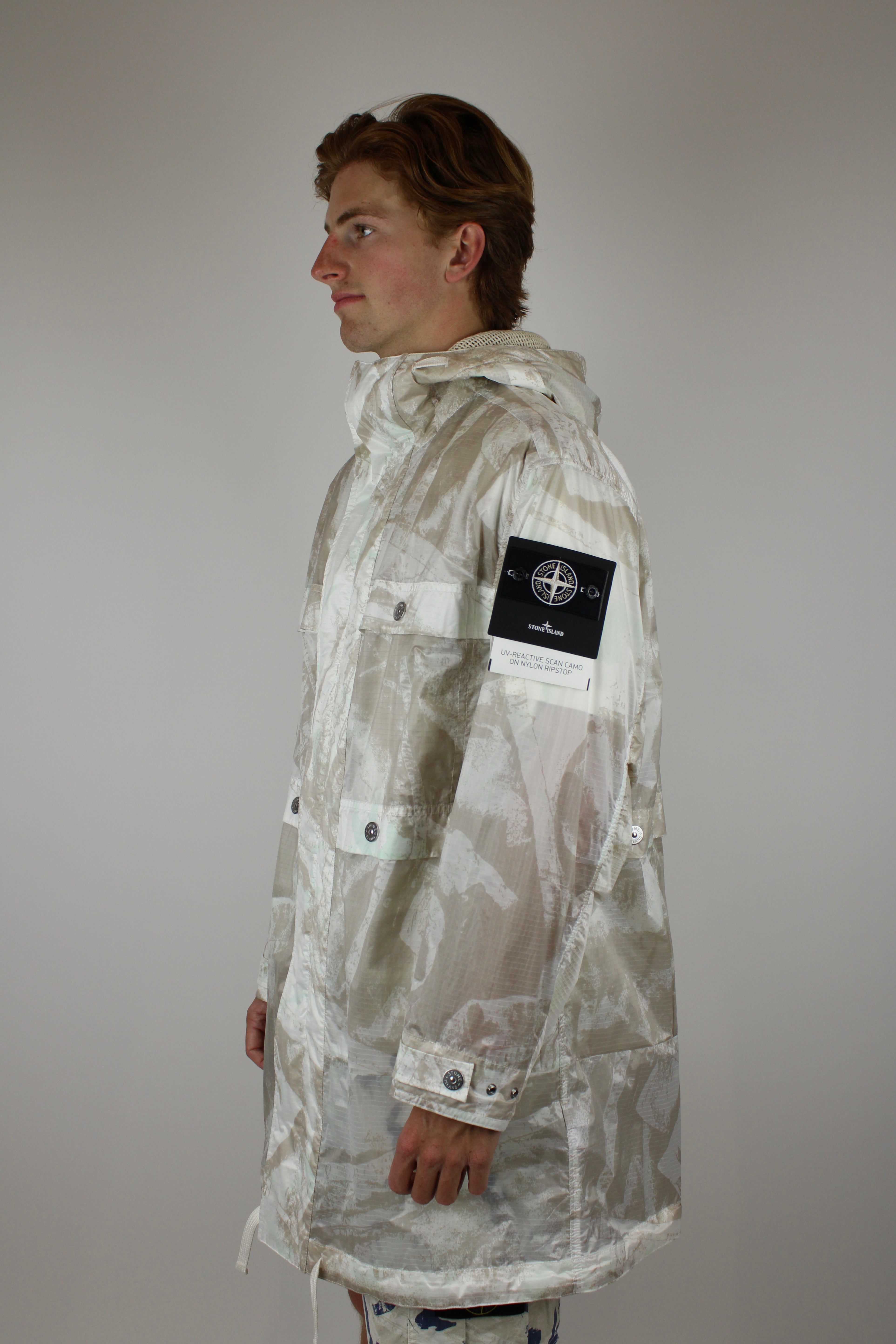 Stone Island UV-reactive Nylon Parka 'Camouflage Desert' – lightweight waterproof jacket with UV-sensitive camouflage pattern, functional design, and iconic logo, perfect for urban and outdoor style.