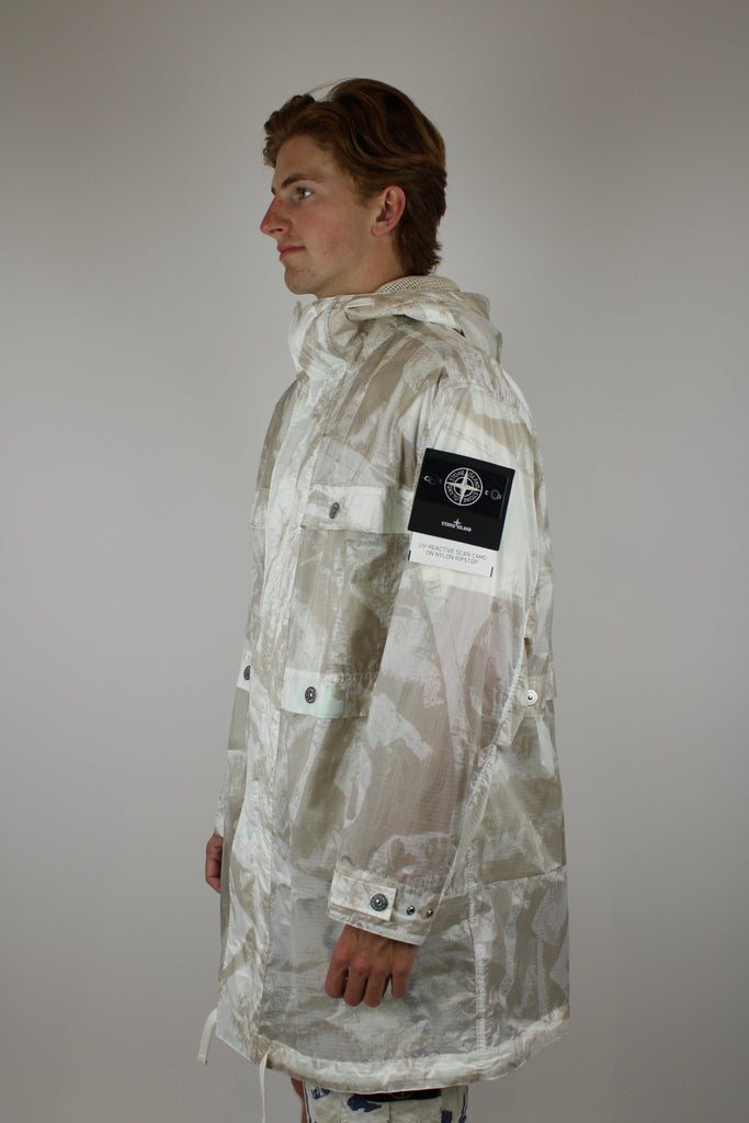 Stone Island UV-reactive Nylon Parka 'Camouflage Desert' – lightweight waterproof jacket with UV-sensitive camouflage pattern, functional design, and iconic logo, perfect for urban and outdoor style.