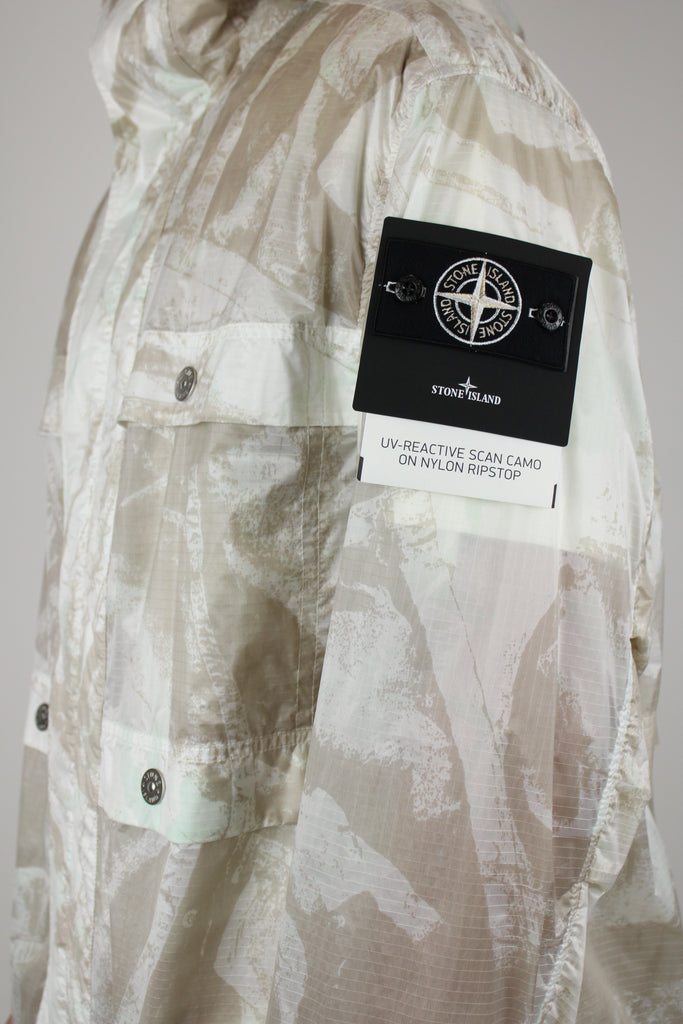 Stone Island UV-reactive Nylon Parka 'Camouflage Desert' – lightweight waterproof jacket with UV-sensitive camouflage pattern, functional design, and iconic logo, perfect for urban and outdoor style.