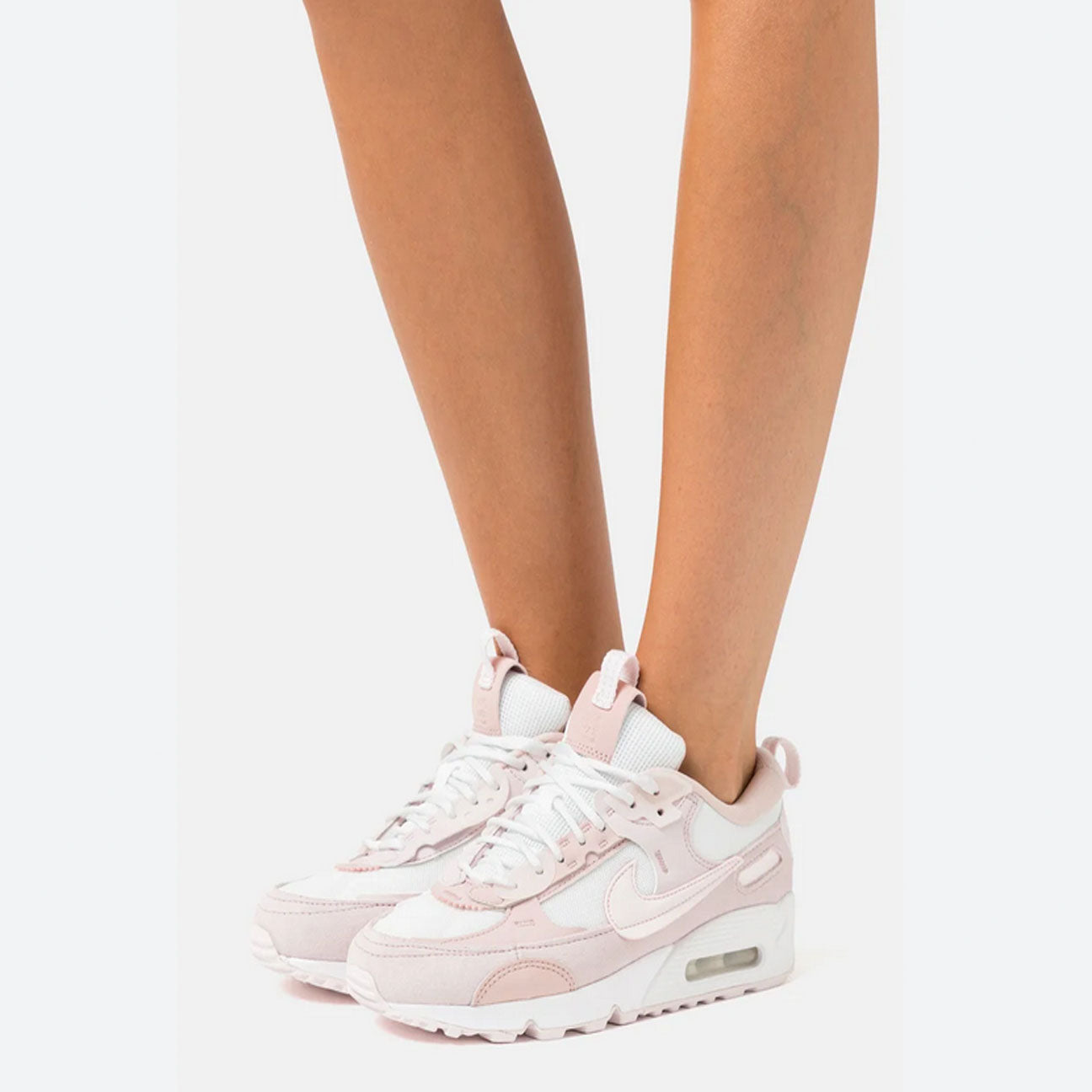Nike Air Max 90 Futura Summit White Barely Rose womens sneaker with mesh and leather upper and visible Air cushioning