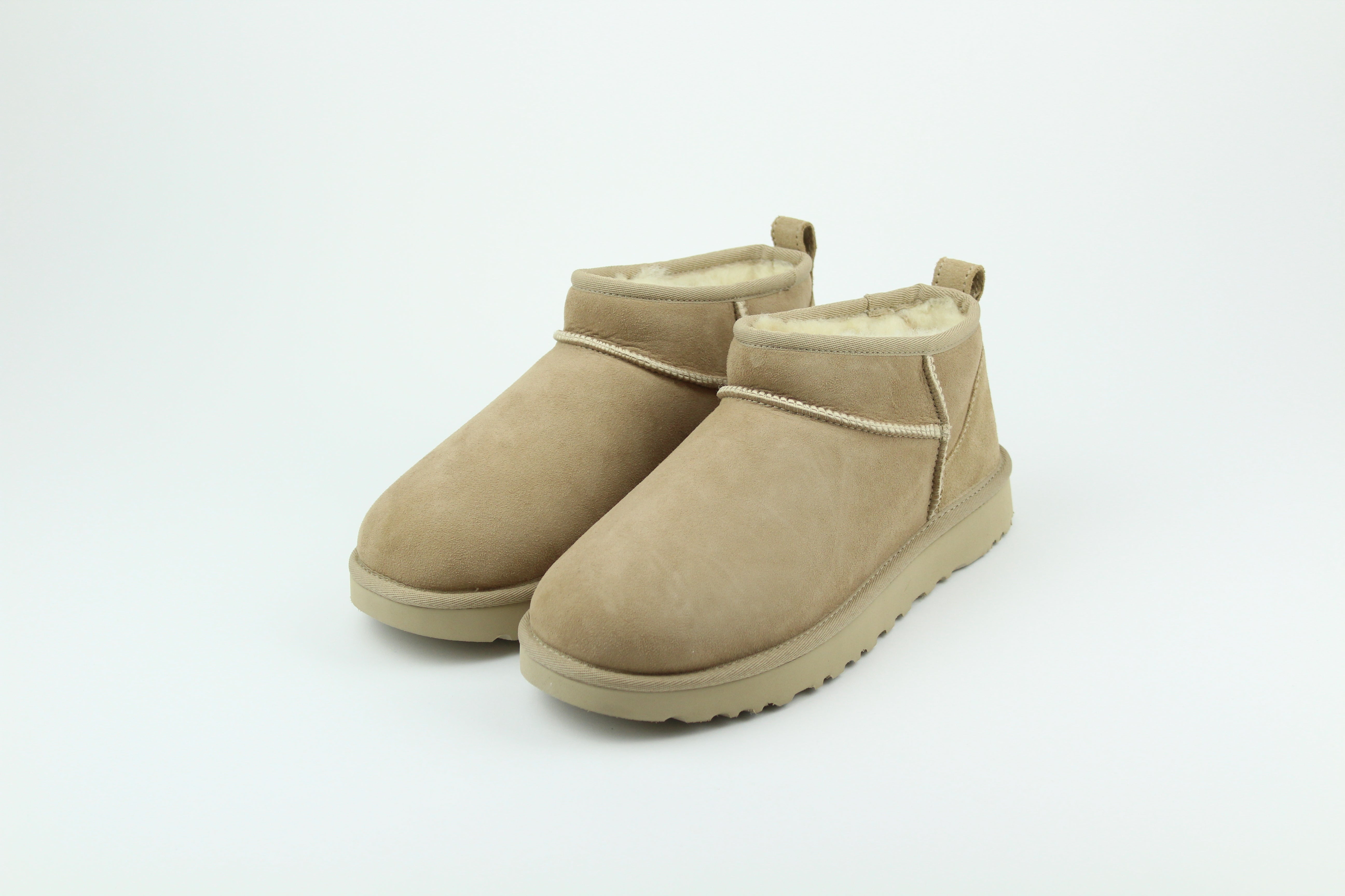 UGG Classic Ultra Mini Sand Women’s – Suede Shearling Ankle Boots, Cozy Winter Footwear, Iconic Comfortable Lifestyle Shoes
